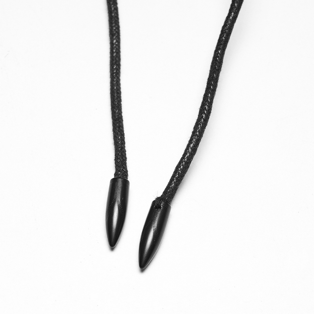 Close-up of black cord endings for trendy accessories or fashion items.