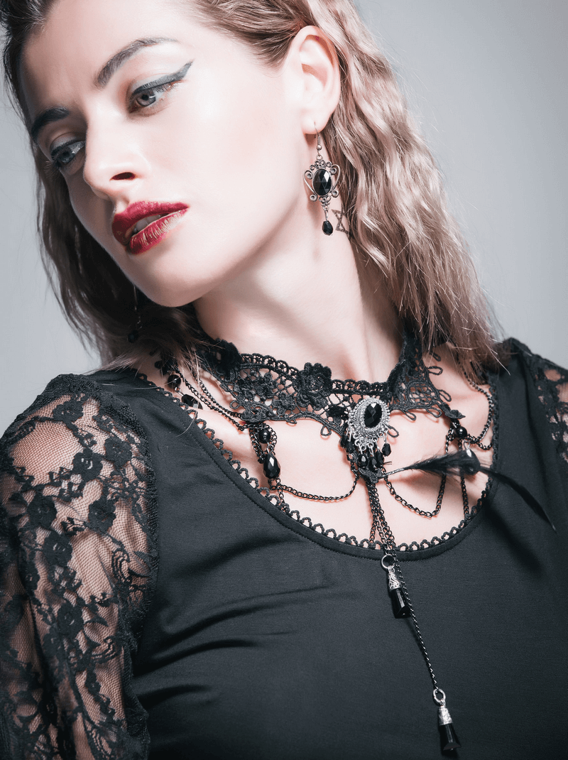 Elegant woman in gothic lace necklace, showcasing black lace and crystal embellishments for a striking look.