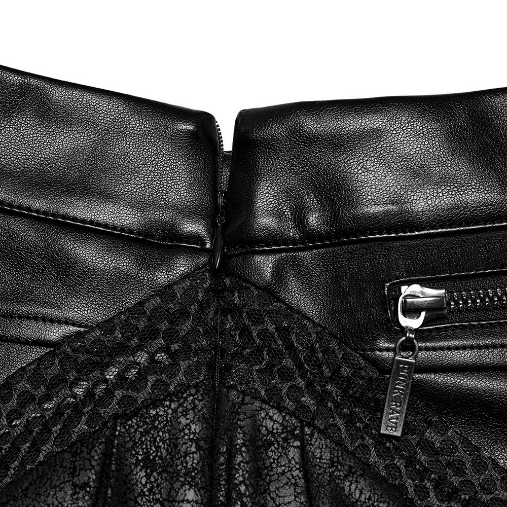 Close-up of zipper details on a black pleated leather skirt, showcasing cracked leather and mesh accents.