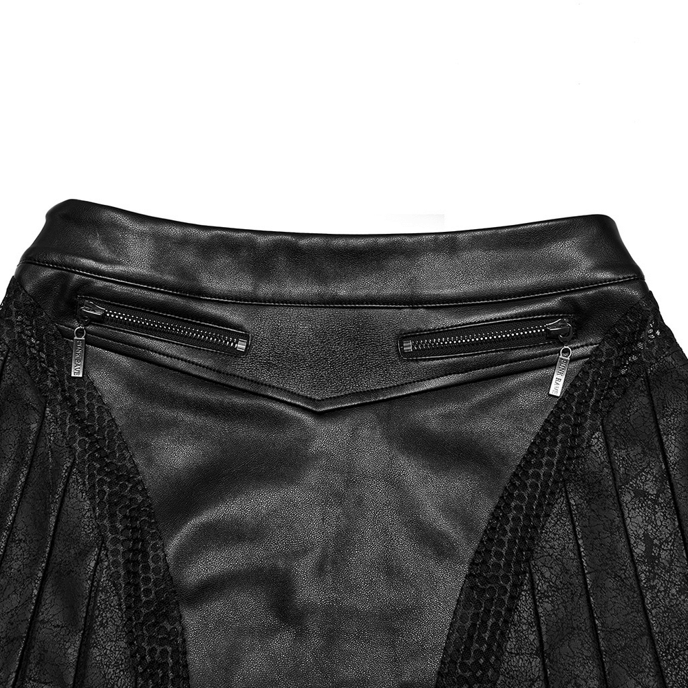 Close-up of a black pleated leather skirt showcasing stylish zippers and mesh detailing for an edgy look.