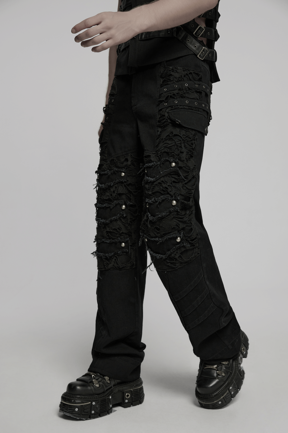Black punk pants with tassels, ripped details, and studs, perfect for edgy street style.