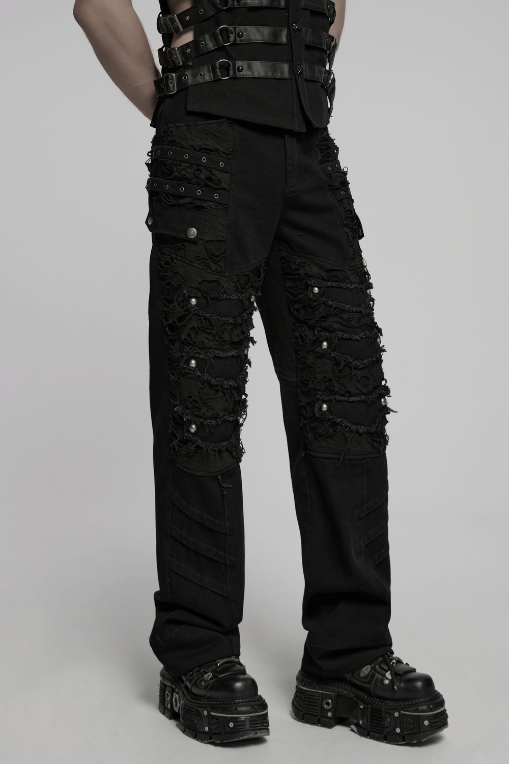 Black punk pants with ripped detail and studs for a rebellious, edgy look.