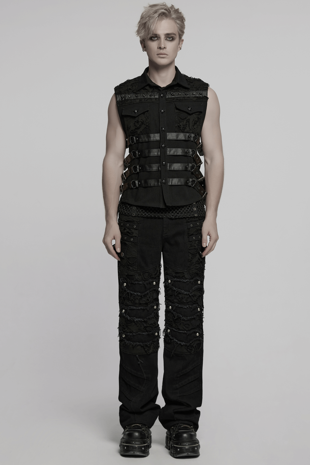 Model wearing black personalized punk pants with tassels and ripped details, showcasing edgy rebel fashion.