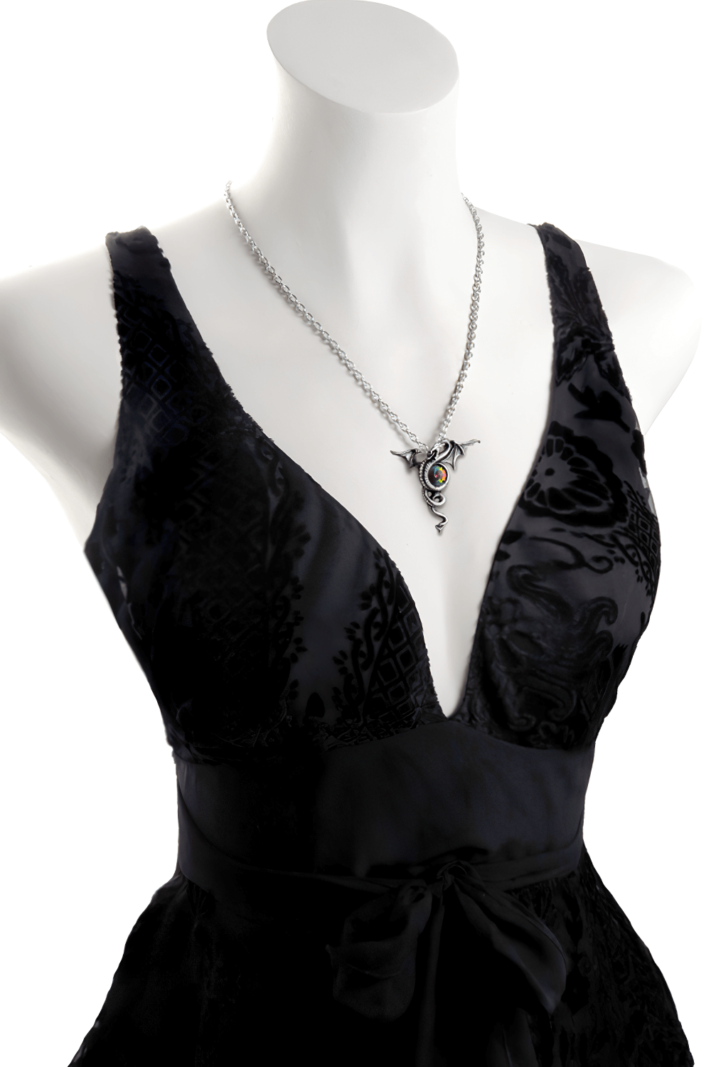 Pewter dragon pendant with rainbow Austrian crystal on a black evening dress mannequin.