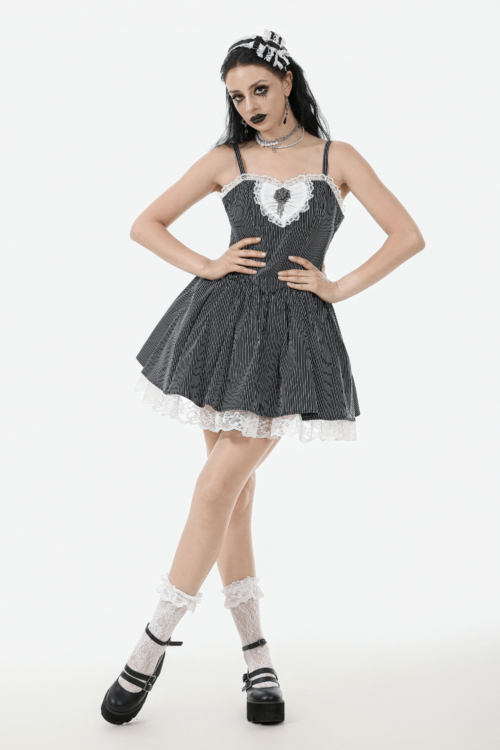 Vintage pinstripe Gothic dress with lace trim, bow, and corset back, perfect for romantic alternative fashion.