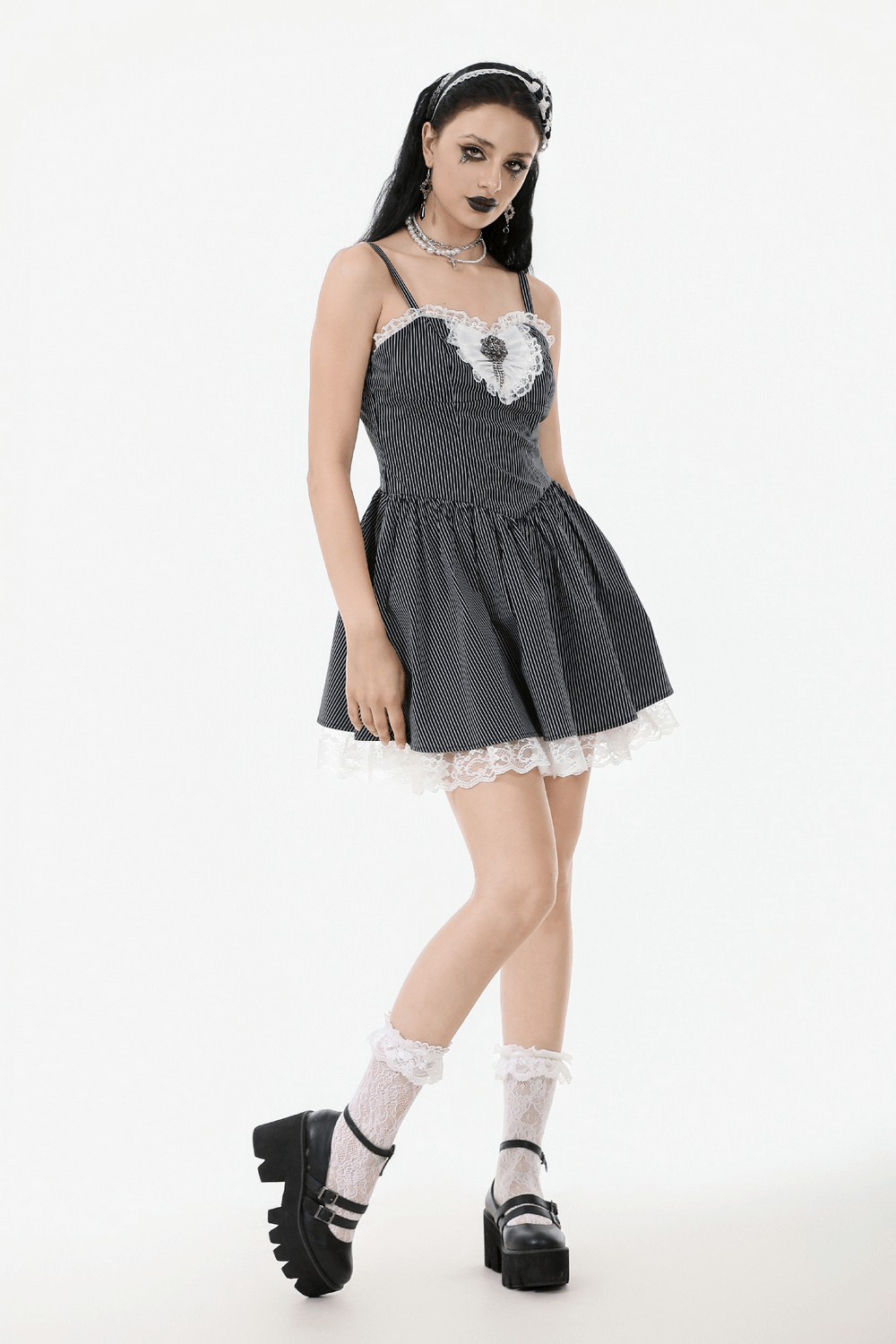 Pinstripe Gothic dress with lace trim, flared skirt, satin bow, perfect for vintage alternative fashion.