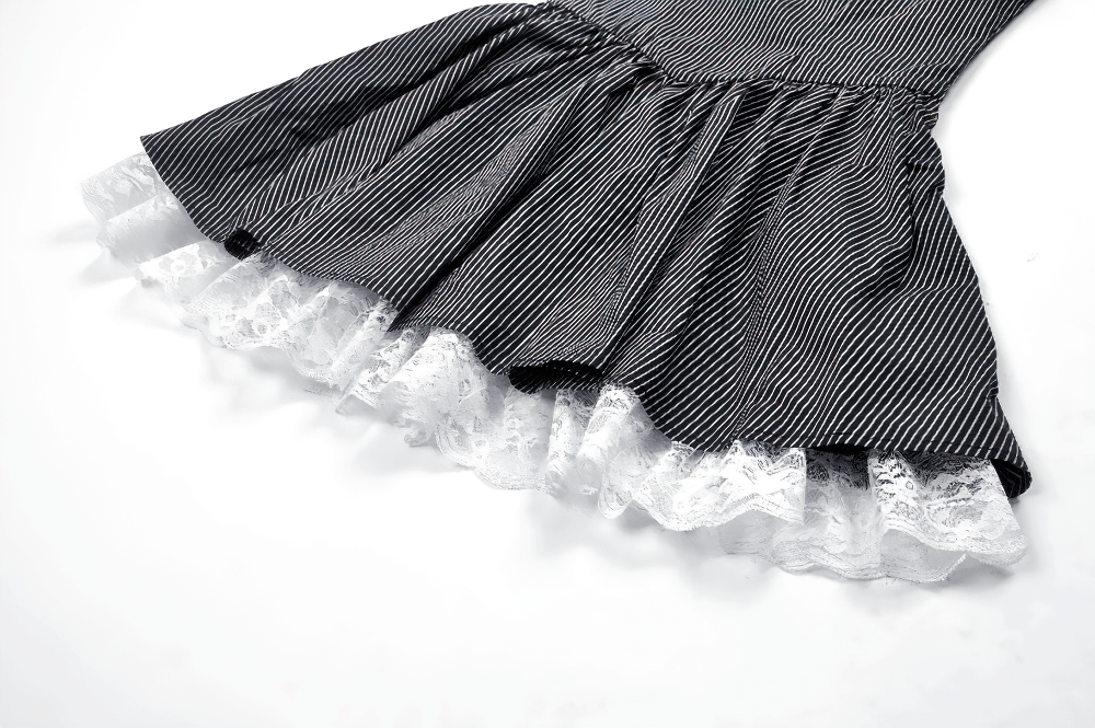 Flared hem of pinstripe Gothic dress showcasing delicate lace trim and ruffled details for a vintage-inspired look.
