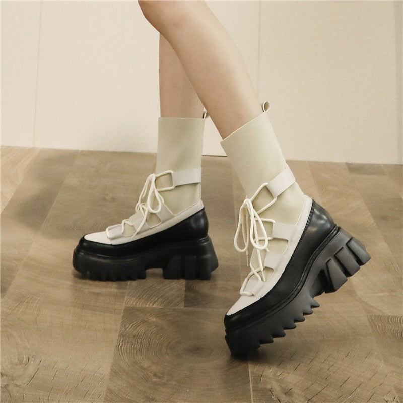 Trendy platform women's lace-up boots in beige and black, perfect for autumn style and punk fashion.