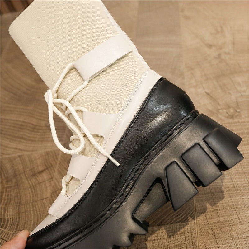 Chunky platform women's lace-up boots in black and white, featuring stretch fabric and a bold design, perfect for punk fashion.