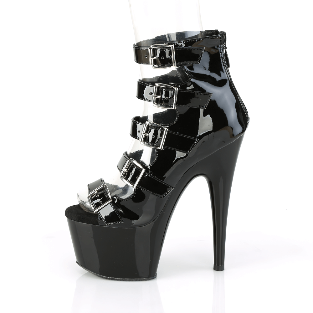 Black patent ankle booties with multiple buckles and 7-inch heel for stylish elevation.