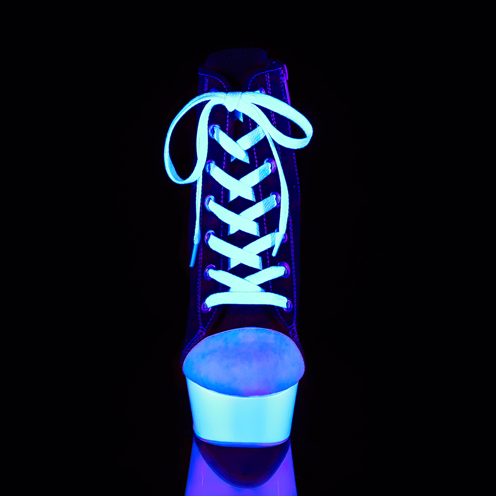 Chic black and white lace-up stiletto heel, glowing in blue light, showcasing a bold design and stylish silhouette.