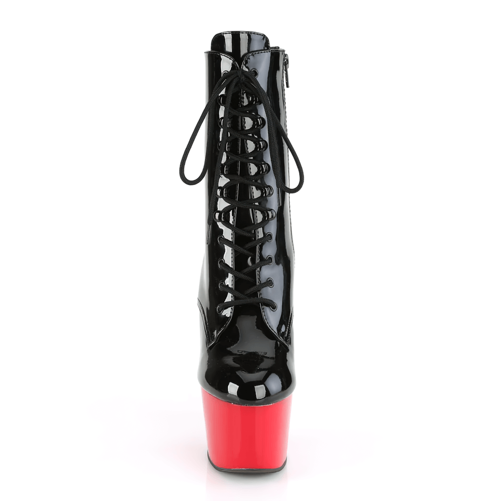 Bold black patent lace-up ankle boots with striking red heels, perfect for making a statement on the dance floor.