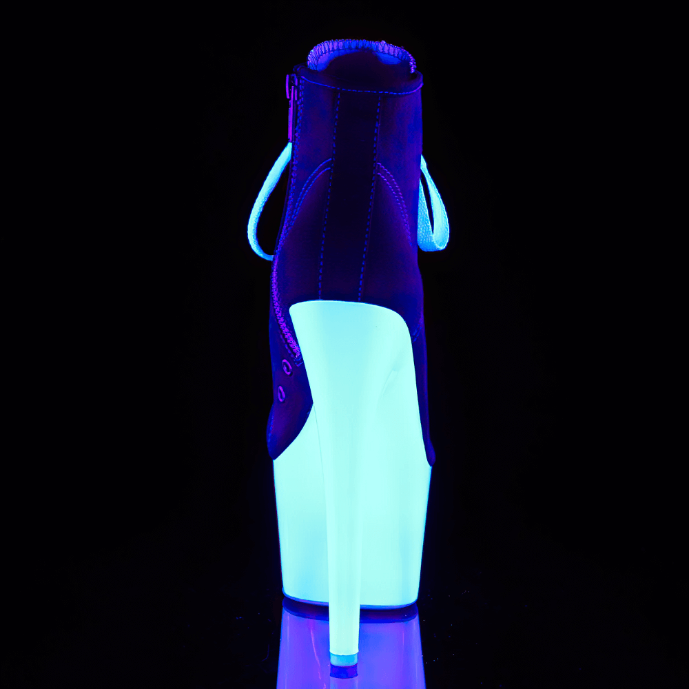 Blacklight reactive Pleaser boots showing glowing platform and heel, perfect for bold fashion under UV light.
