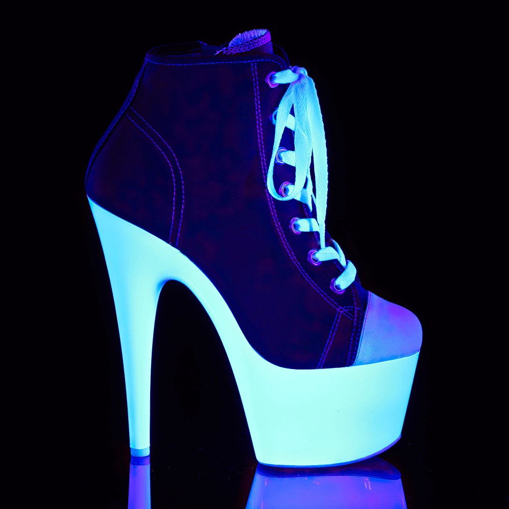 High-top Pleaser boots with blacklight reactive platform glowing under UV light.