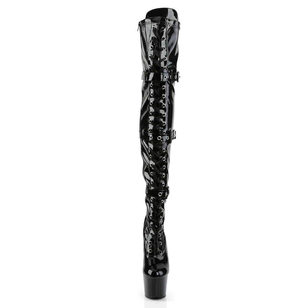 High-gloss black thigh-high stiletto boots with lace-up and buckle design for a dramatic fashion statement.