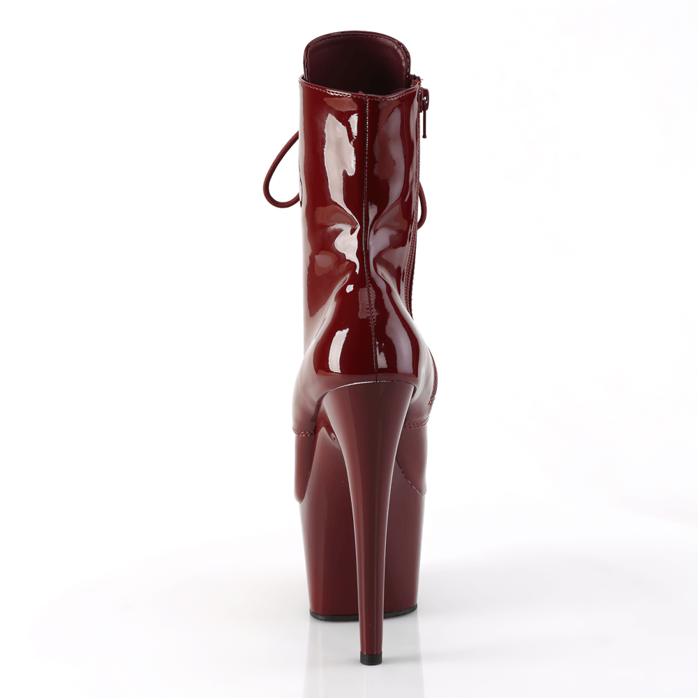 Back view of PLEASER burgundy lace-up ankle boots with stiletto heels and side zip, showcasing striking glossy finish.