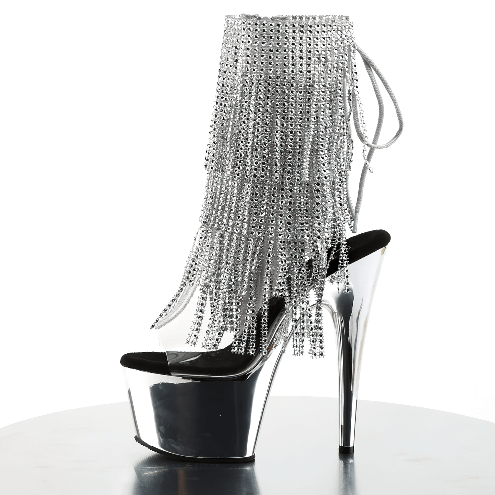 Sleek PLEASER fringe stiletto heels with chrome platform, rhinestone detail, and lace-up back for ultimate glam.