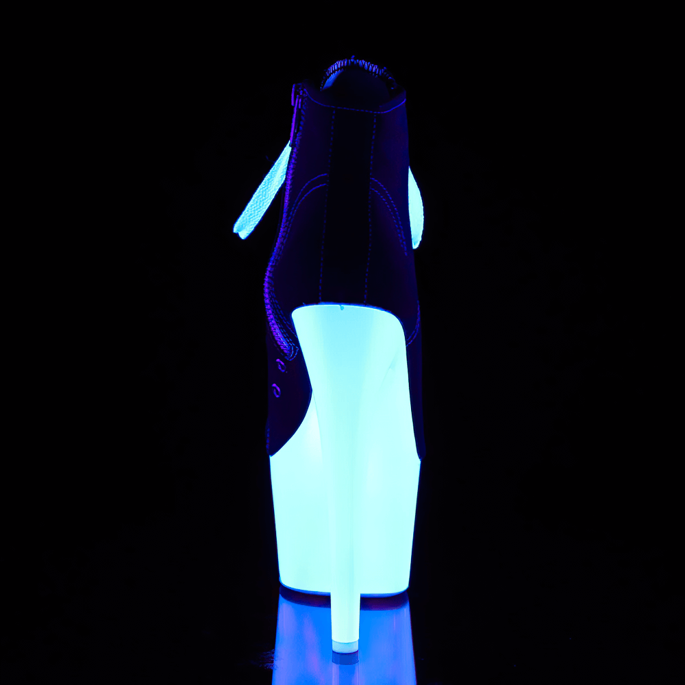Back view of Pleaser high-top platform boots with glowing UV reactive sole under blacklight.