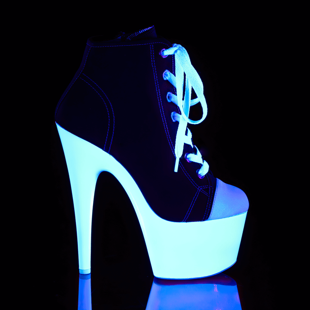 PLEASER High-Top Boots Heels with UV reactive sole glowing under blacklight, featuring a dramatic 7-inch heel.