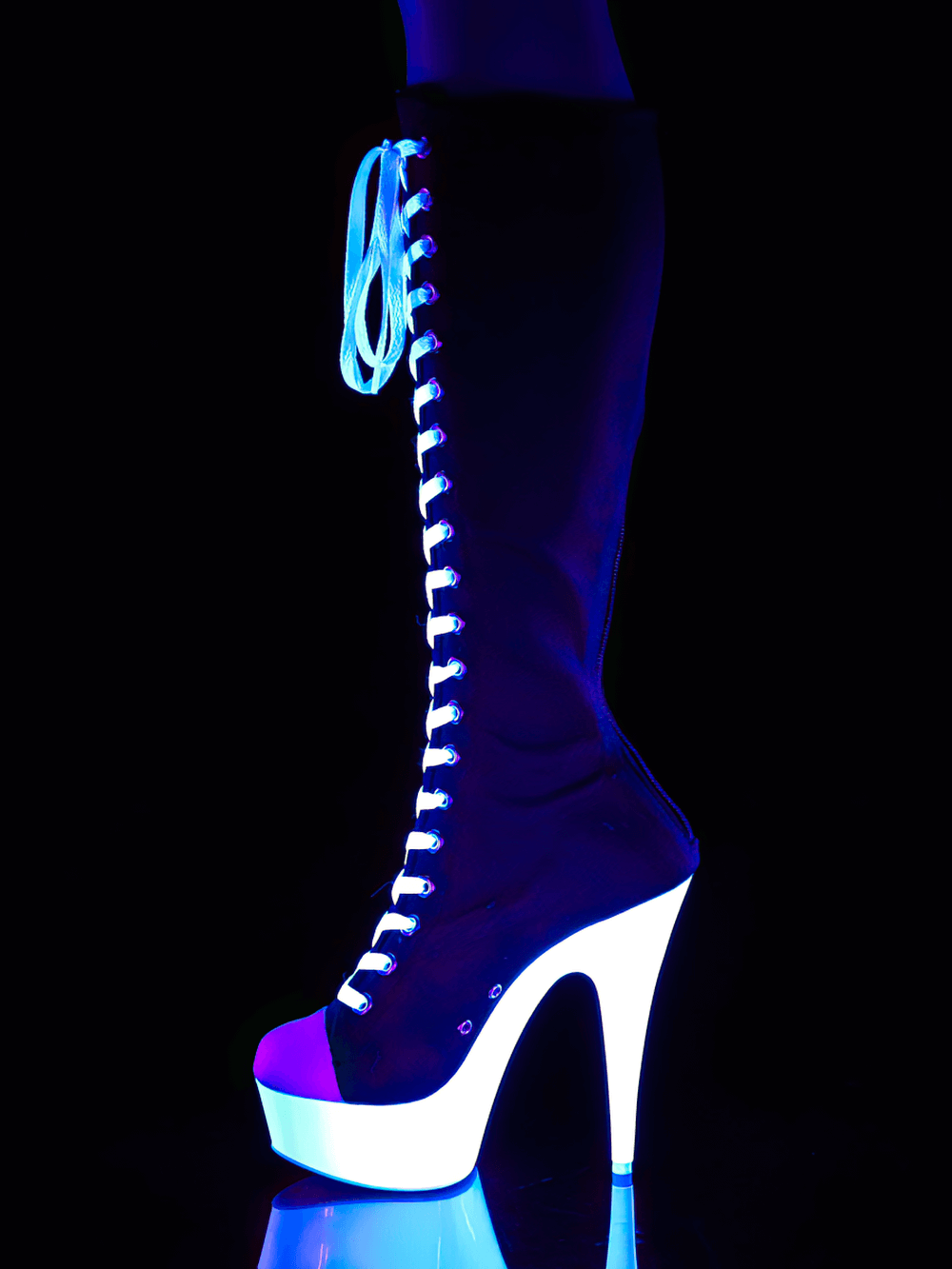 Knee-high lace-up canvas sneaker boot with platform and blacklight-reactive outsole, glowing in neon colors.