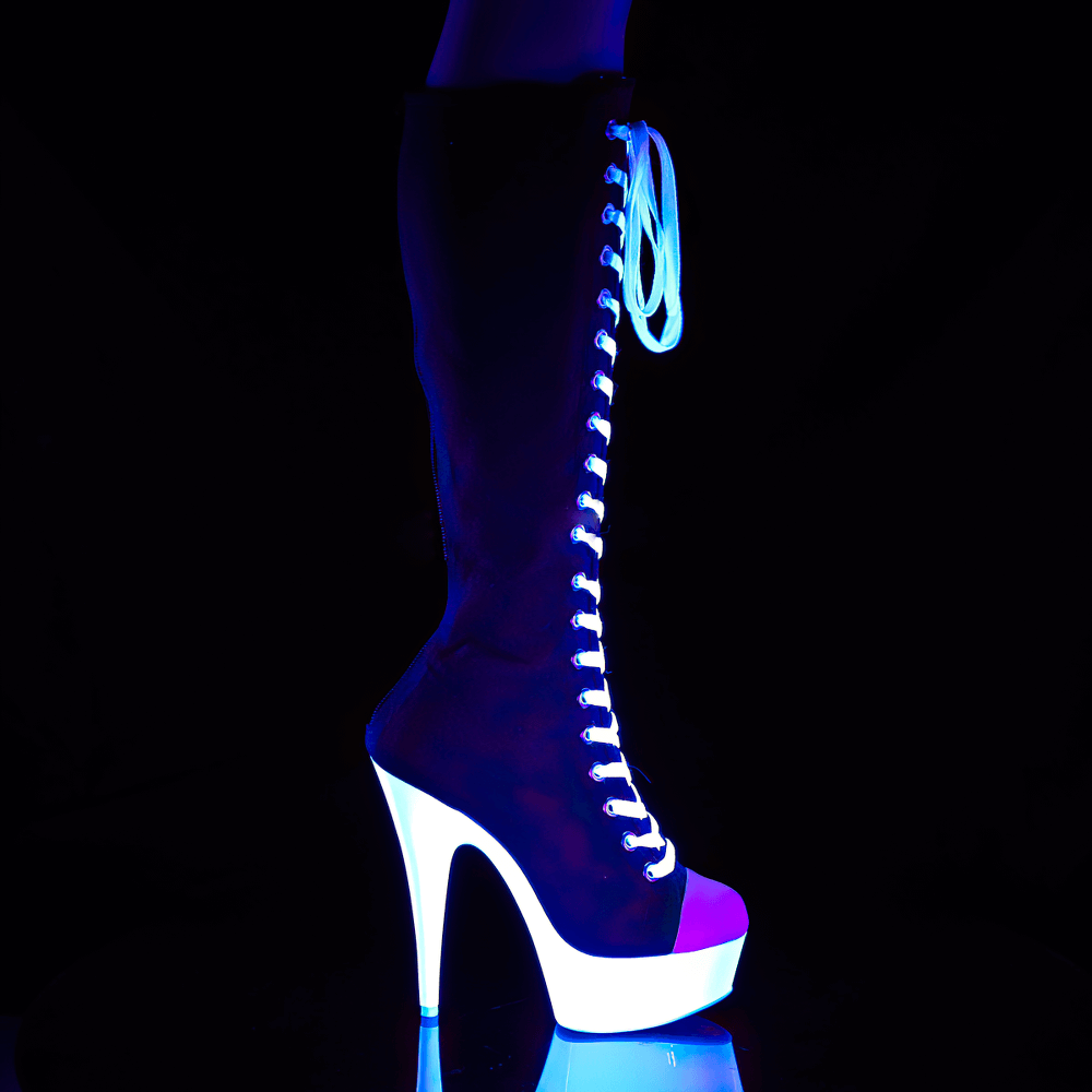 Blacklight reactive knee-high lace-up canvas sneaker boots with striking platform heel.