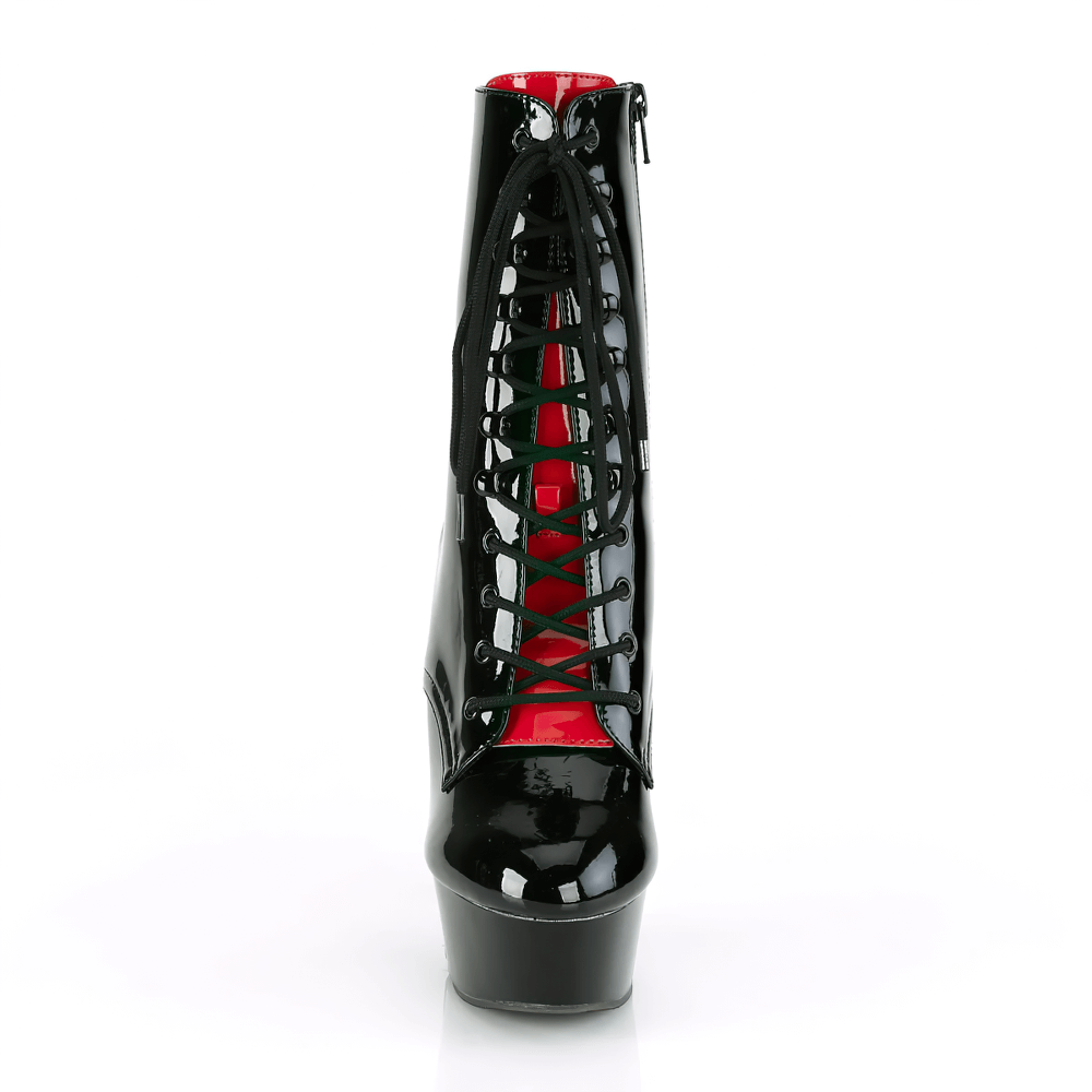 Black lace-up platform ankle boots with red interior and intricate corset detailing, showcasing a bold gothic style.