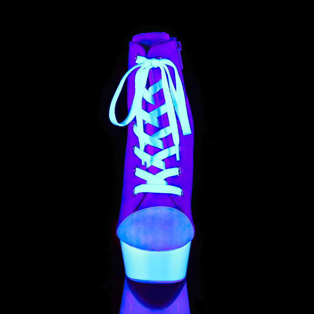 Bold pink and white lace-up stiletto heels glowing under UV light, showcasing vibrant style and chic design.