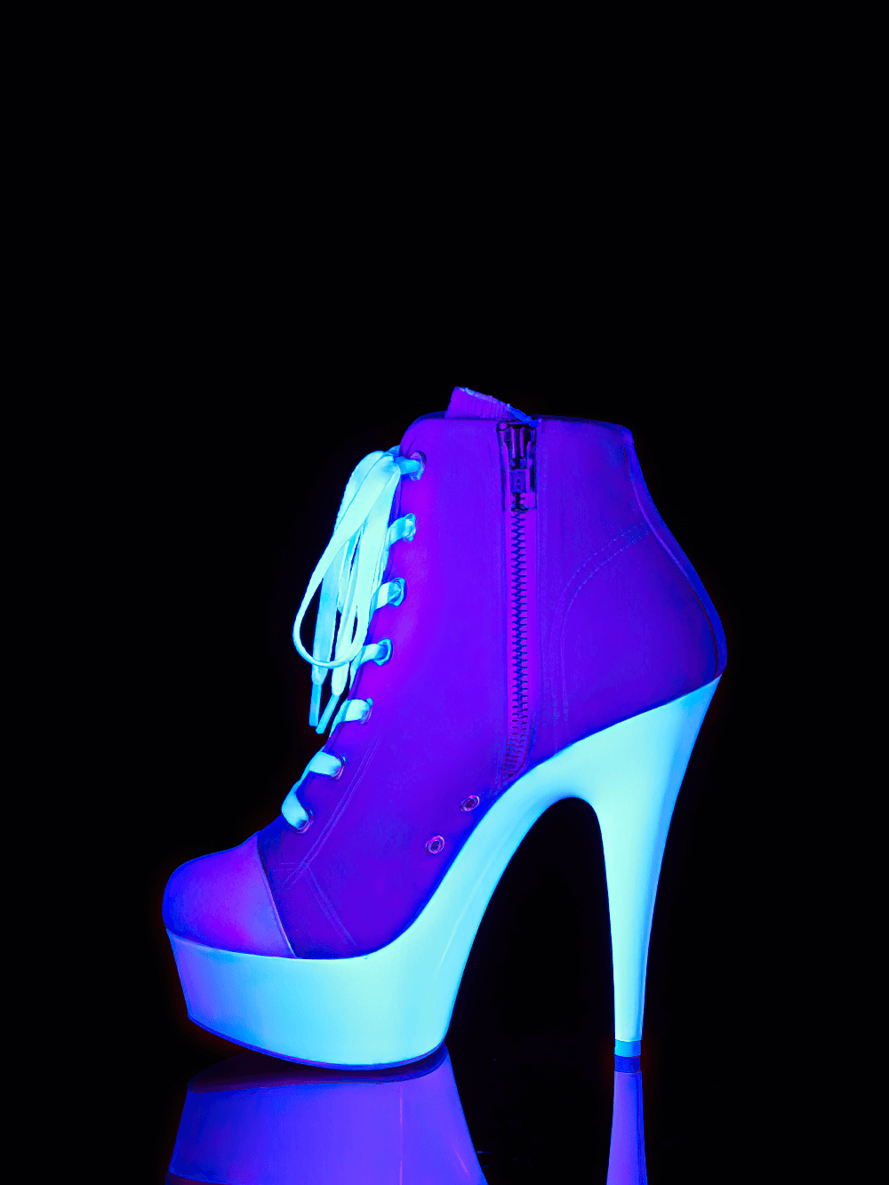 Bold pink and white stiletto heels with lace-up design and zip closure, stylish and chic.