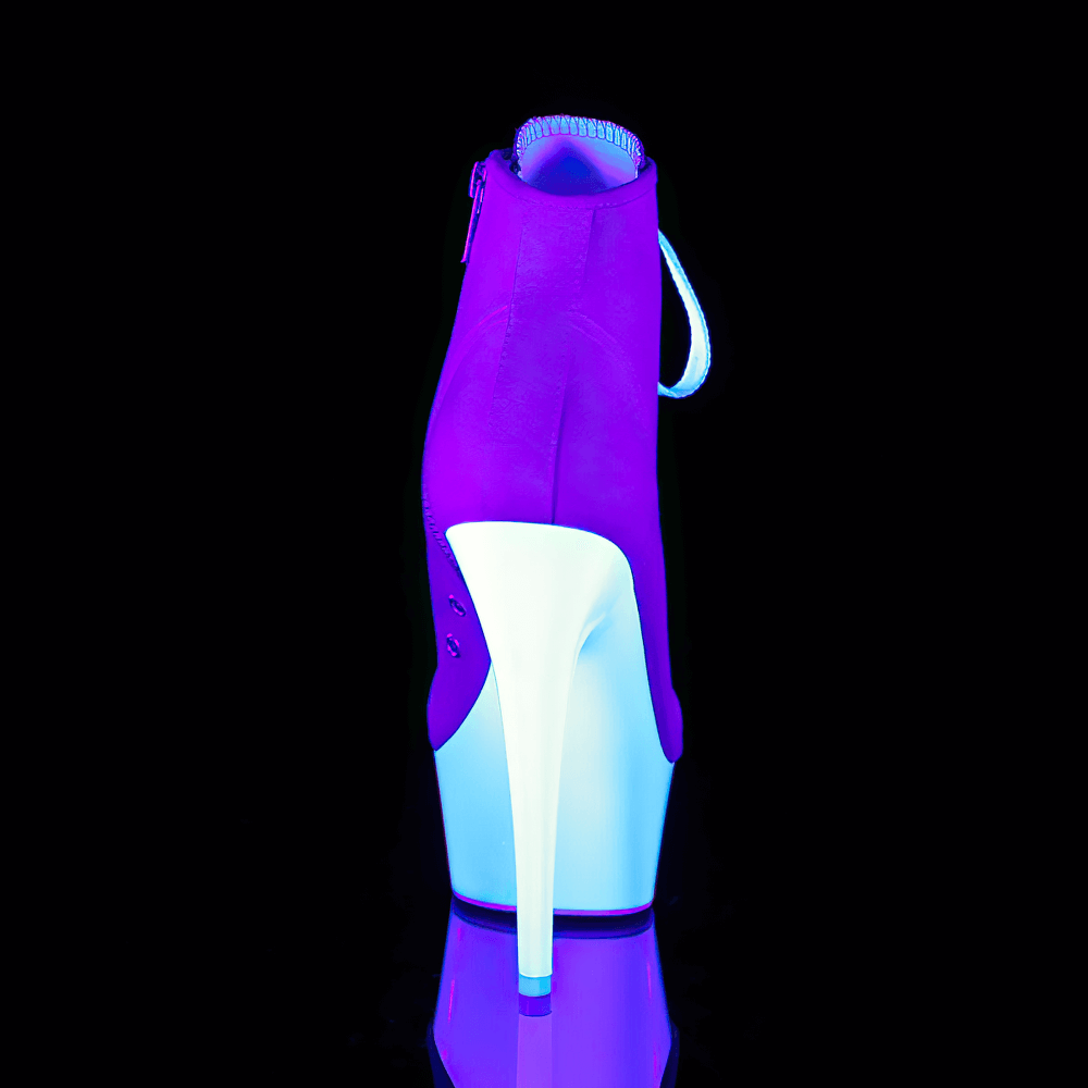 Bold PLEASER pink and white stiletto heels with lace-up and zip closure, showcasing a striking silhouette.