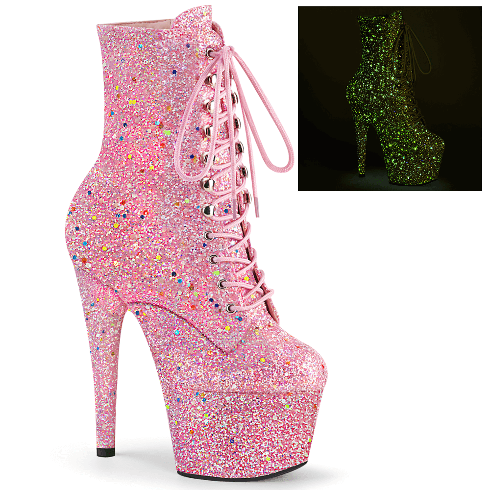 Pink glitter lace-up ankle boots with blacklight reactive shine and 7-inch heels for a bold, edgy look.