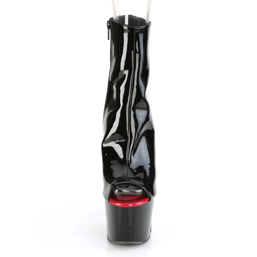Glossy black peep-toe ankle boot with red accents and lace-up detail, featuring a high heel and platform.