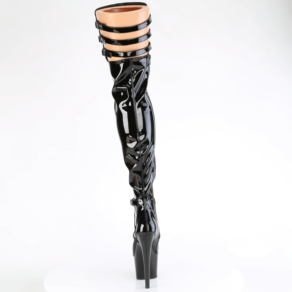 Sleek patent thigh-high black boots with ankle buckle and triple rear straps, showcasing a dramatic heel.