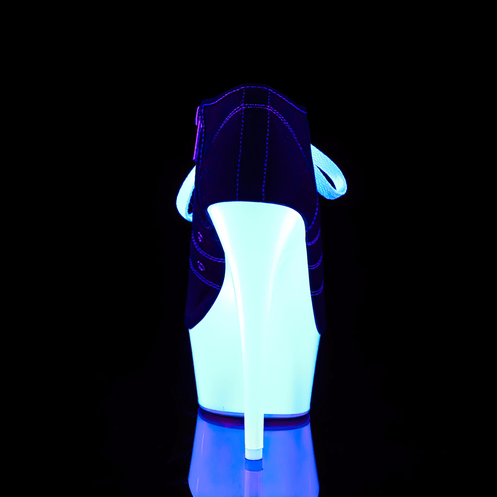 Back view of UV reactive Pleaser stiletto heels with glowing platform under blacklight.