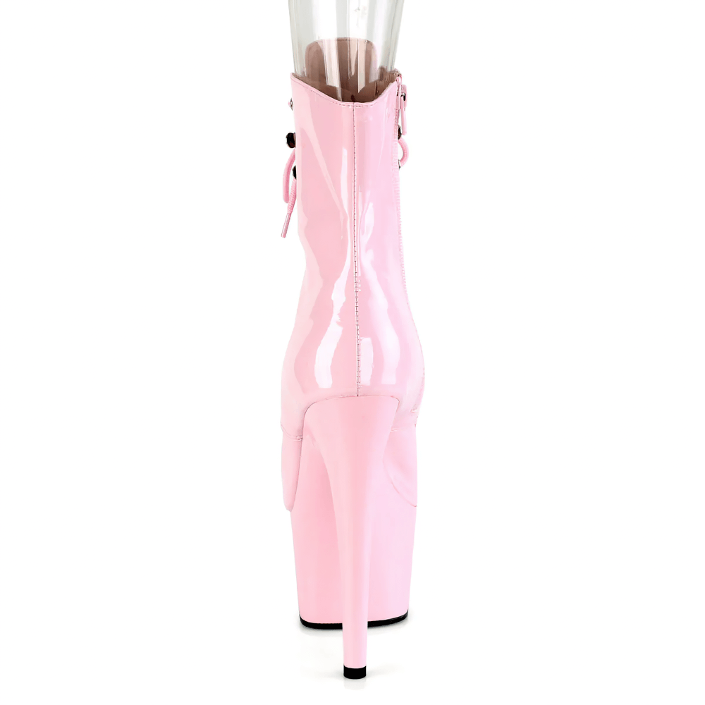 Back view of stylish pink stiletto peep-toe ankle boots with platform and lace-up detail.