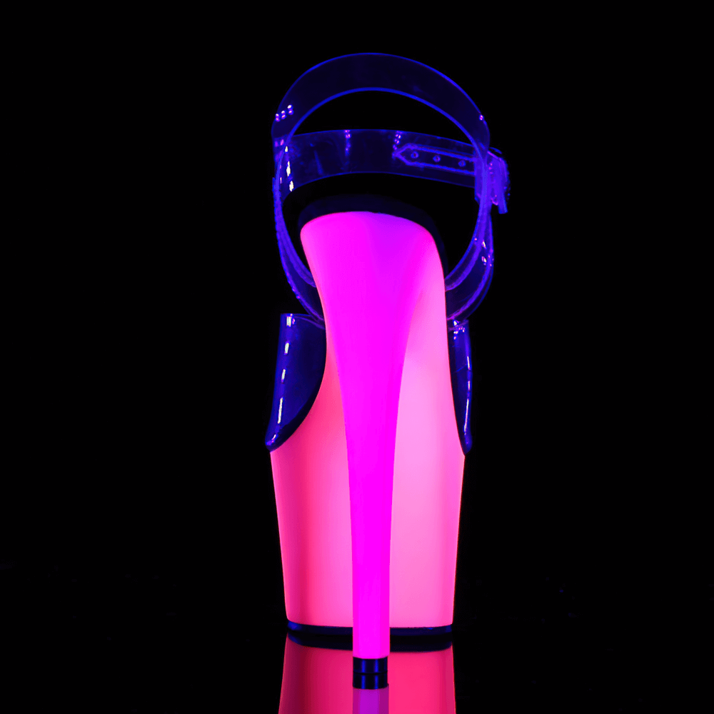 UV reactive neon sandals with clear straps and vibrant pink heel glowing under blacklight.