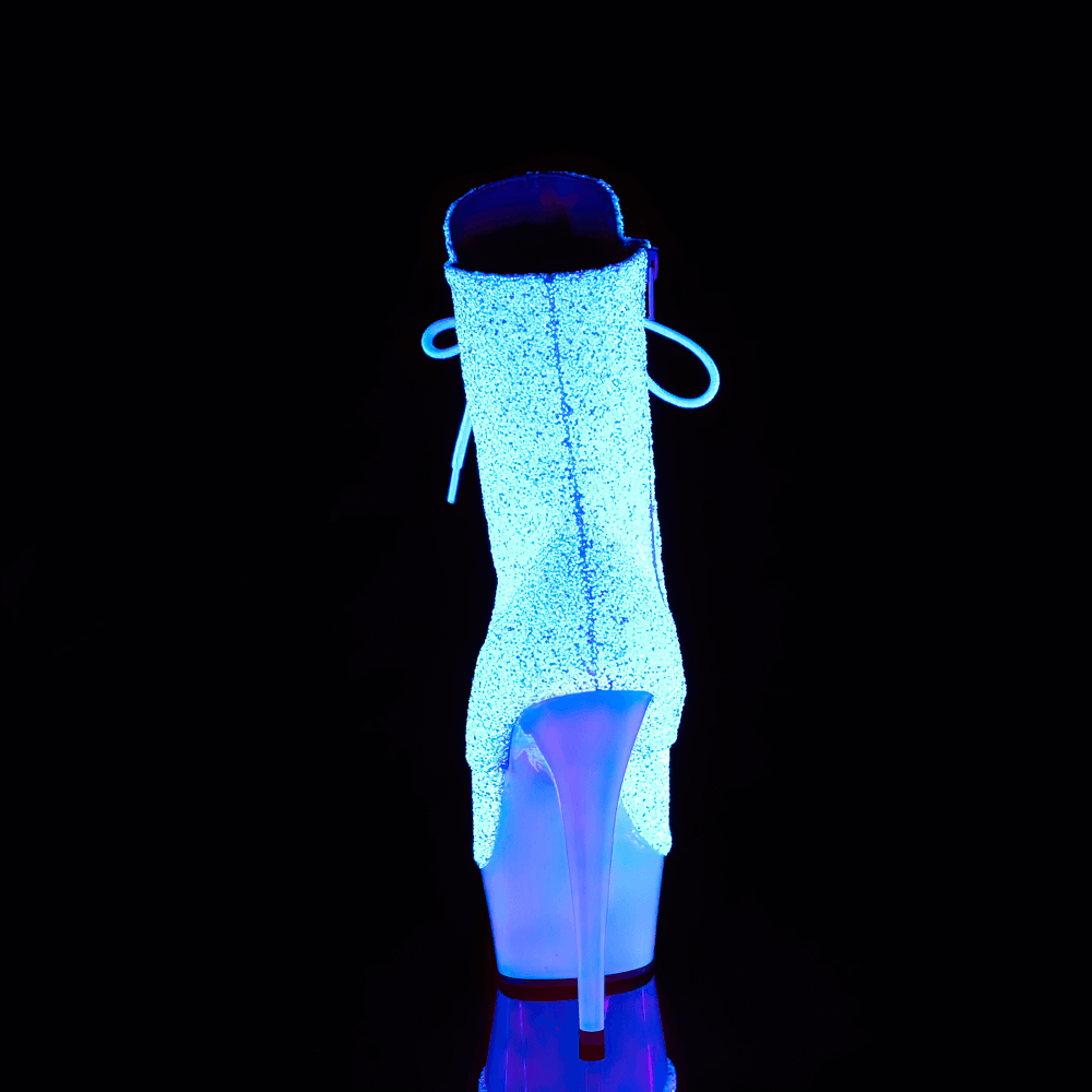 Luminous white glitter lace-up ankle boots glowing neon under blacklight with a striking 6" heel.