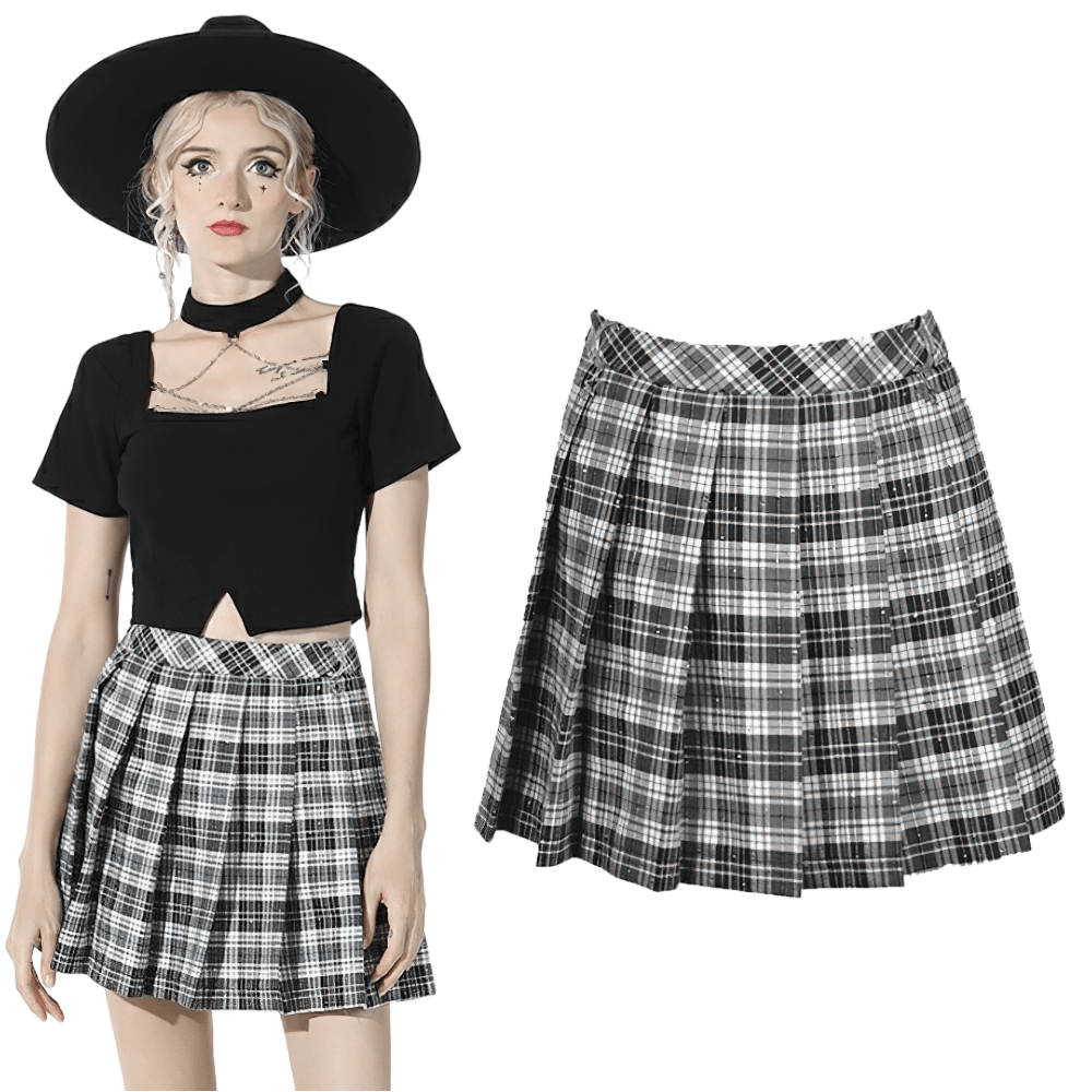Edgy black and white plaid pleated mini skirt, styled with a chic black crop top and wide-brim hat.