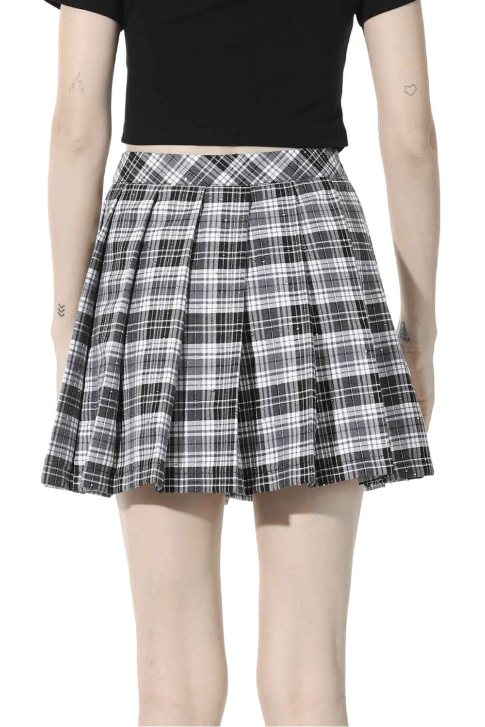 Back view of a pleated black and white plaid mini skirt, perfect for edgy grunge fashion.