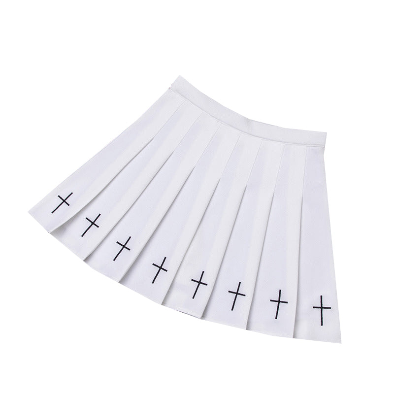 Pleated white mini skirt with black crosses, perfect for gothic and rock chick outfits.