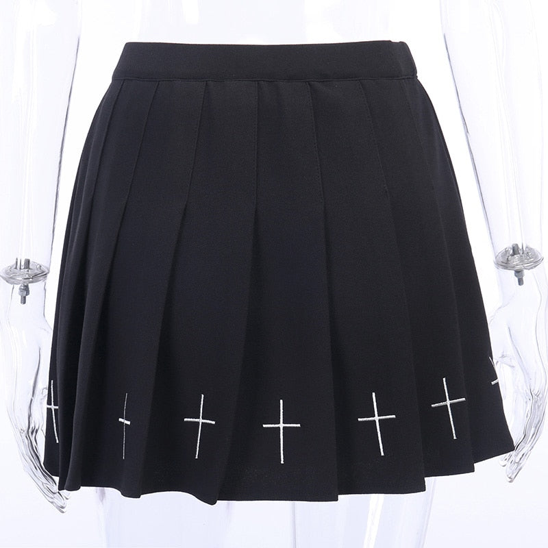 Black pleated mini skirt with white cross details, perfect for gothic outfits and Halloween parties.