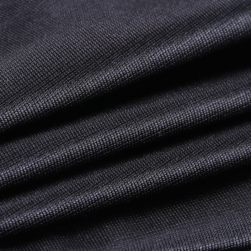 Close-up of elegant black fabric showcasing pleats, perfect for gothic mini skirts and rock chick outfits.