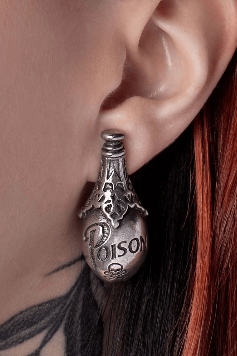Gothic poison bottle earrings in fine pewter, showcasing intricate design and skull symbol for a dark statement.