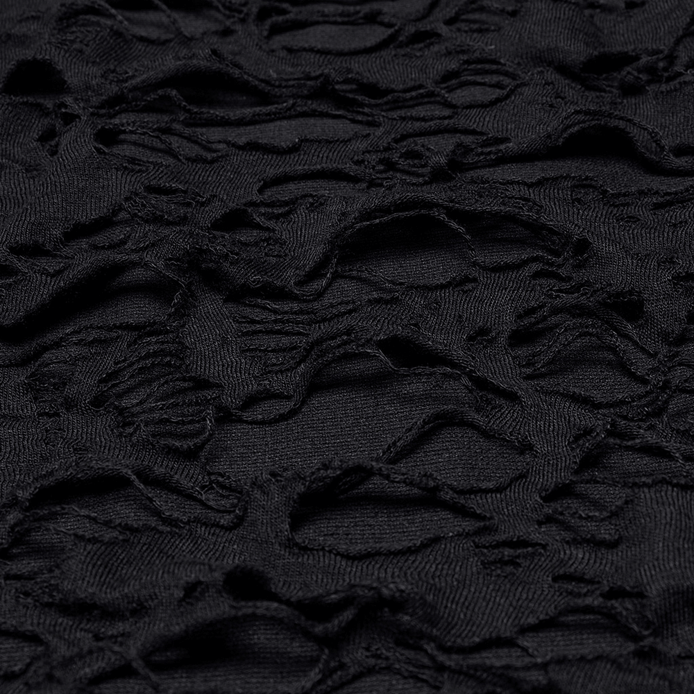 Close-up of distressed black knit fabric showcasing edgy, post-apocalyptic texture and unique tear details.