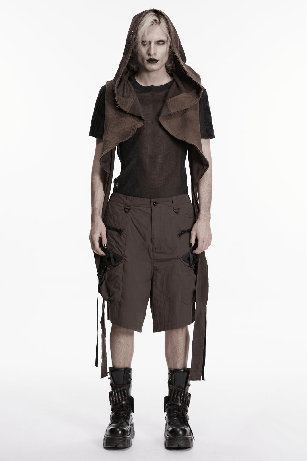 Post Apocalyptic Hooded Sleeveless Cape Vest For Men worn by a model with a dark, alternative style and cargo shorts.