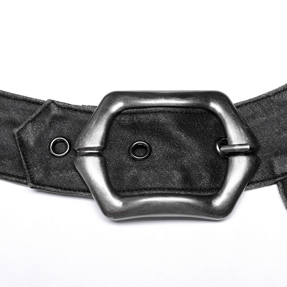 Close-up of an adjustable zigzag buckle on a post-apocalyptic leather bag for a punk style.