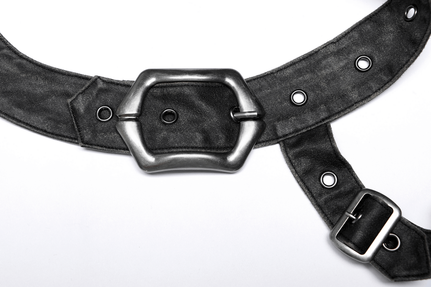 Close-up of a rugged black leather strap with a stylish metal buckle and decorative grommets, perfect for post-apocalyptic fashion.