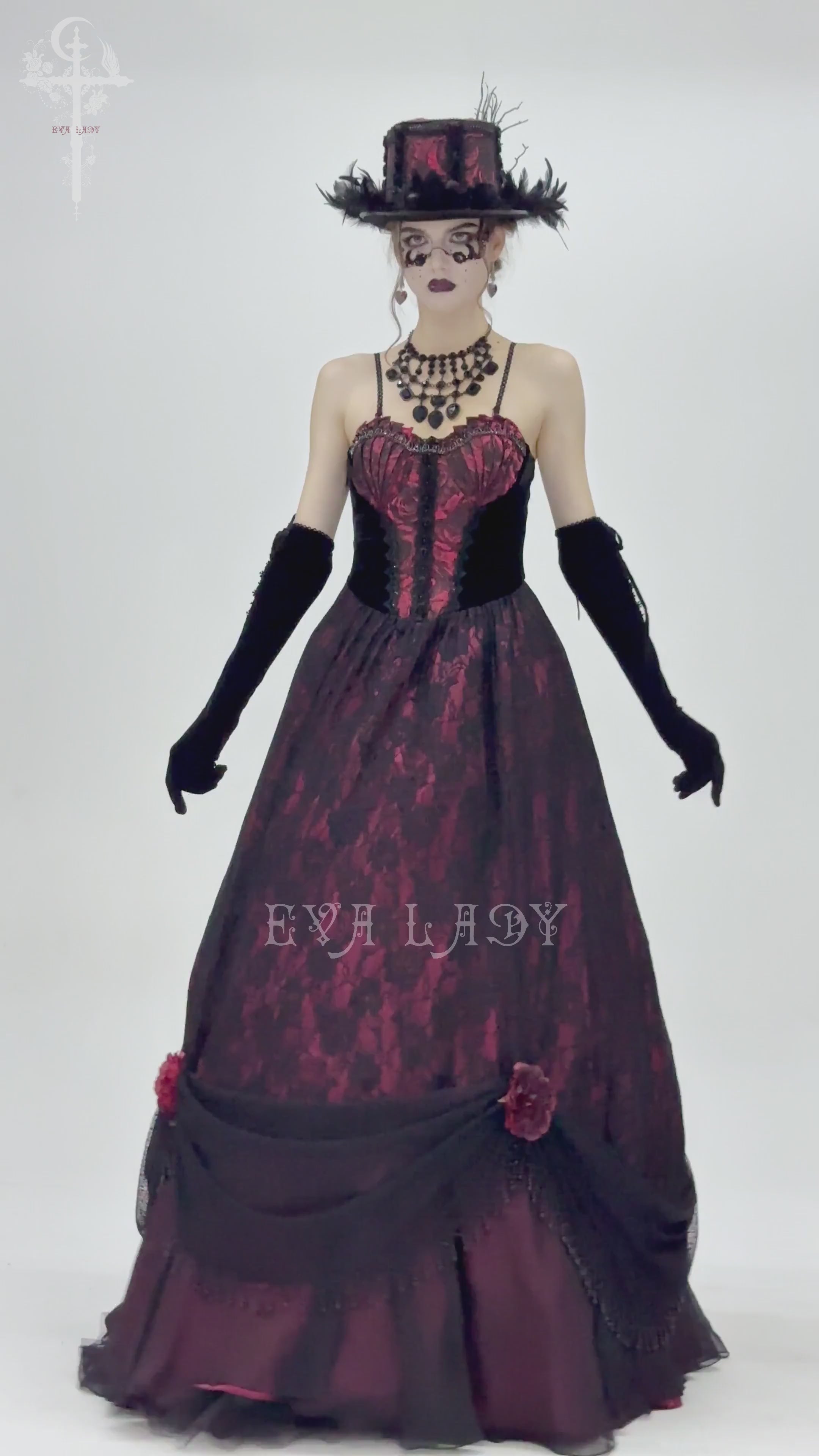 Gothic black lace evening gown with wine red corset, floral details, and dramatic flowing skirt.