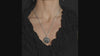 St. Levantius Protective Pendant with Dual-Sided Design displayed on a person's neck, showcasing its intricate details.