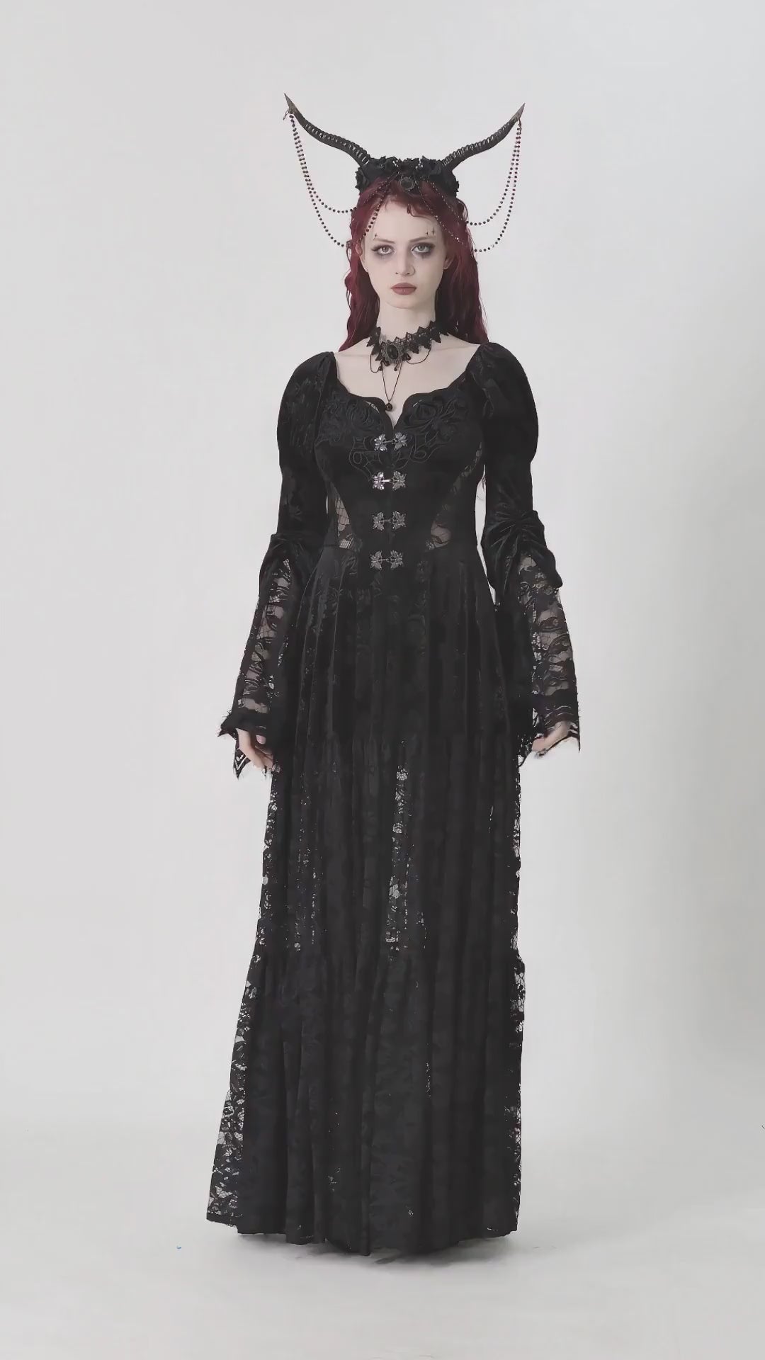 Gothic evening cape with floral accents worn by model, featuring Victorian lace details and elegant long sleeves.