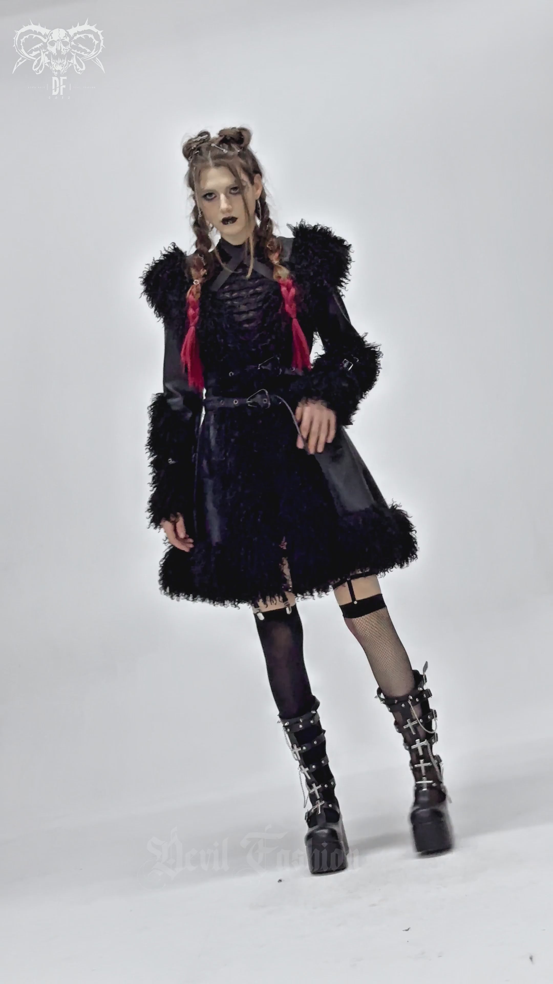 Gothic black faux leather coat with fur trim, showcasing punk style and edgy fashion for women.